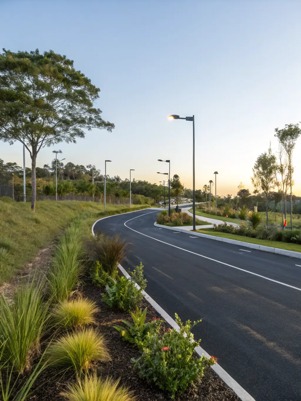 An aerial view of a newly constructed pavement area, showcasing the precision and quality of the work, with surrounding landscaping and infrastructure visible, emphasizing Epav'Express's expertise in new pavement construction.